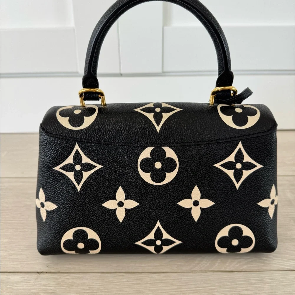 LOUIS VUITTON
Empreinte Monogram Giant Madeleine BB Black Beige - Picture 3 of 8